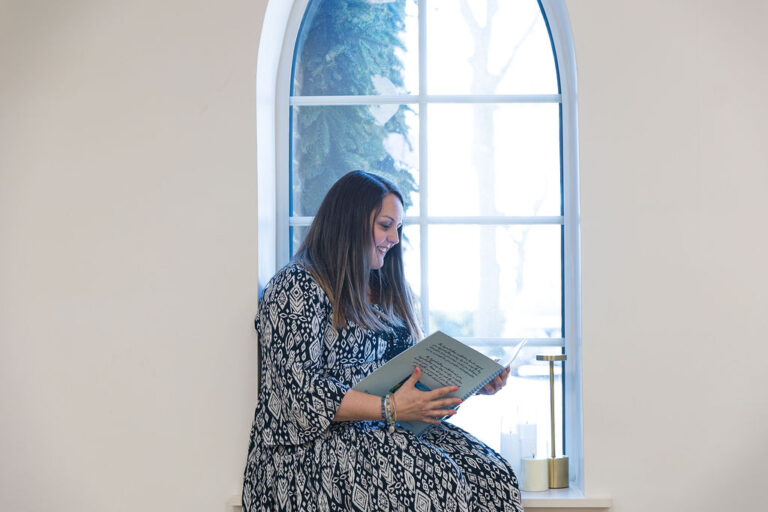 Danielle reading a handbook