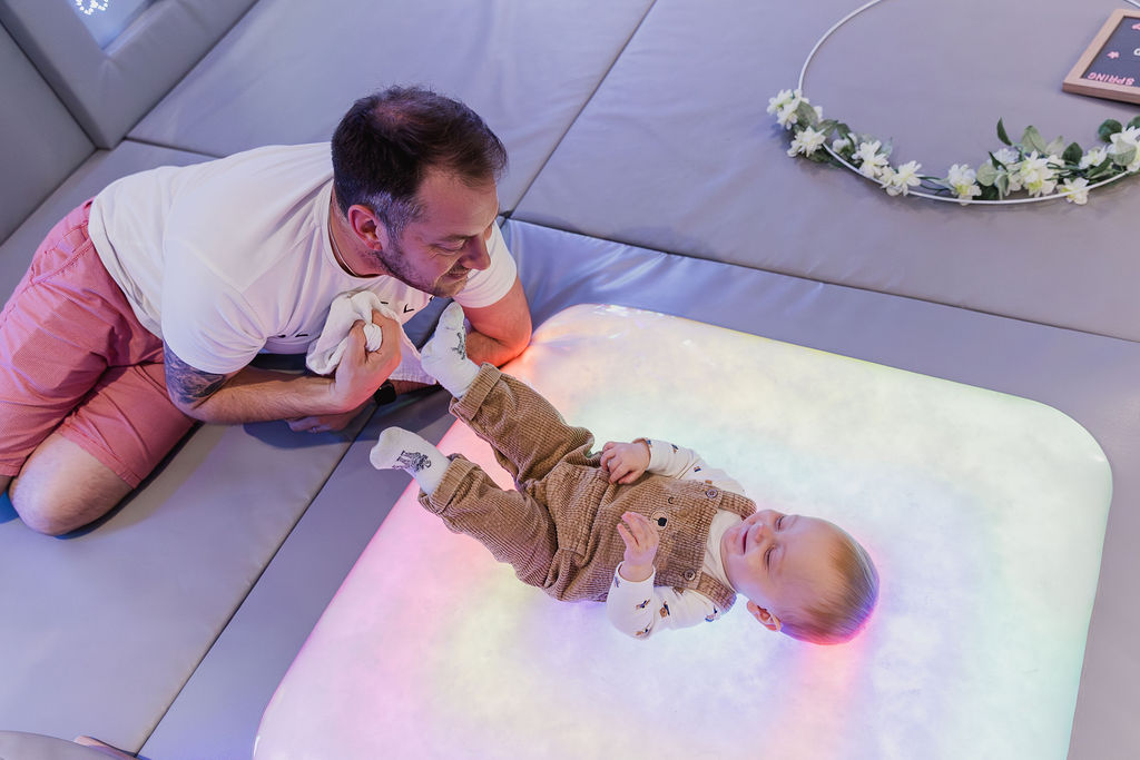 Dad playing in the sensory play room