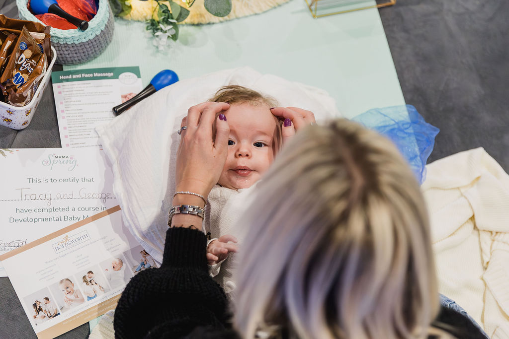 mum massaging her baby's head